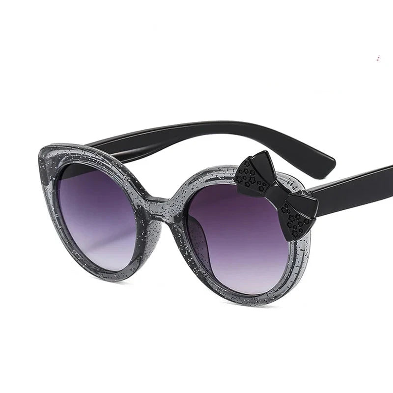 cat eye kids sunglasses, UV400 kids sunglasses, baby eyewear,
bowknot sunglasses, girls' fashion sunglasses, cute children's eyewear,
circular frame sunglasses, trendy baby shades, stylish girls' sunglasses, acrylic lenses, alla chic.