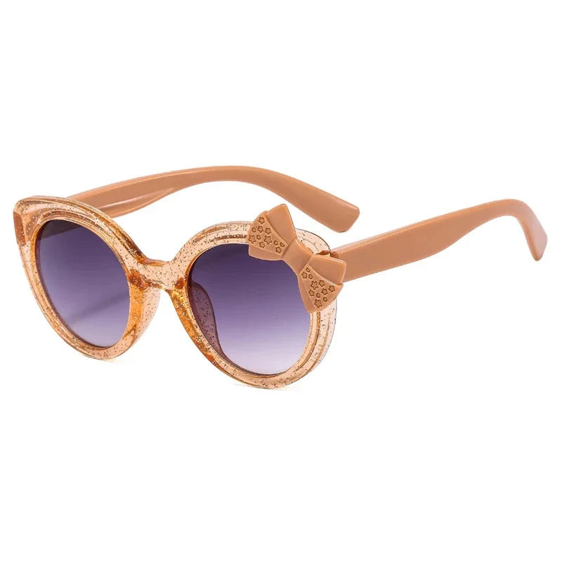 cat eye kids sunglasses, UV400 kids sunglasses, baby eyewear,
bowknot sunglasses, girls' fashion sunglasses, cute children's eyewear,
circular frame sunglasses, trendy baby shades, stylish girls' sunglasses, acrylic lenses, alla chic.