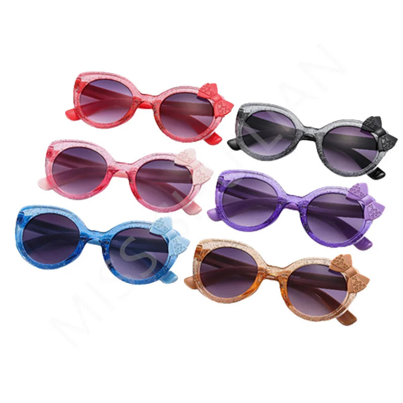 cat eye kids sunglasses, UV400 kids sunglasses, baby eyewear,
bowknot sunglasses, girls' fashion sunglasses, cute children's eyewear,
circular frame sunglasses, trendy baby shades, stylish girls' sunglasses, acrylic lenses, alla chic.