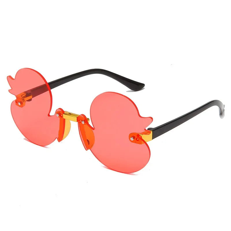 duck-shaped sunglasses, kids rimless eyewear, UV400 kids sunglasses, cartoon duck glasses, boys' fun sunglasses, anti-reflective sunglasses for kids, lightweight polycarbonate frames, kids decorative party glasses, playful sun protection, stylish children’s eyewear