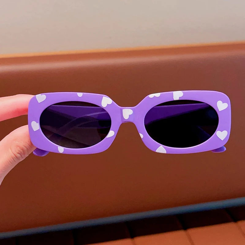 kids heart-shaped sunglasses, rectangular polarised eyewear, UV400 kids glasses, girls’ vintage sunglasses, trendy kids sun protection, outdoor kids eyewear, stylish wrap sunglasses, lightweight child sun shades, polycarbonate sunglasses for kids, glare-reducing eyewear