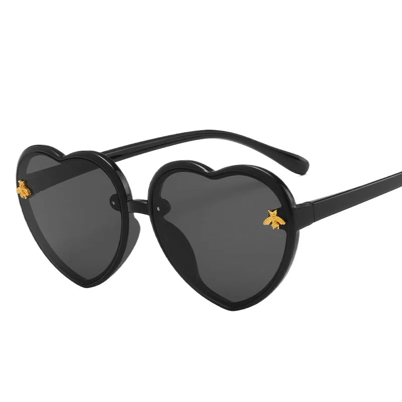 kids heart sunglasses, candy colour eyewear, UV400 kids glasses, cute cartoon sunglasses, trendy children’s eyewear, girls outdoor sunglasses, fashionable cat-eye frames, heart-shaped sun glasses, stylish kids eyewear, lightweight UV protection