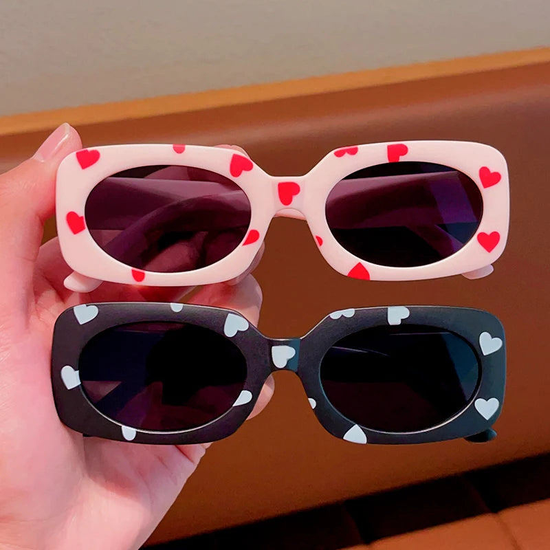 kids heart-shaped sunglasses, rectangular polarised eyewear, UV400 kids glasses, girls’ vintage sunglasses, trendy kids sun protection, outdoor kids eyewear, stylish wrap sunglasses, lightweight child sun shades, polycarbonate sunglasses for kids, glare-reducing eyewear