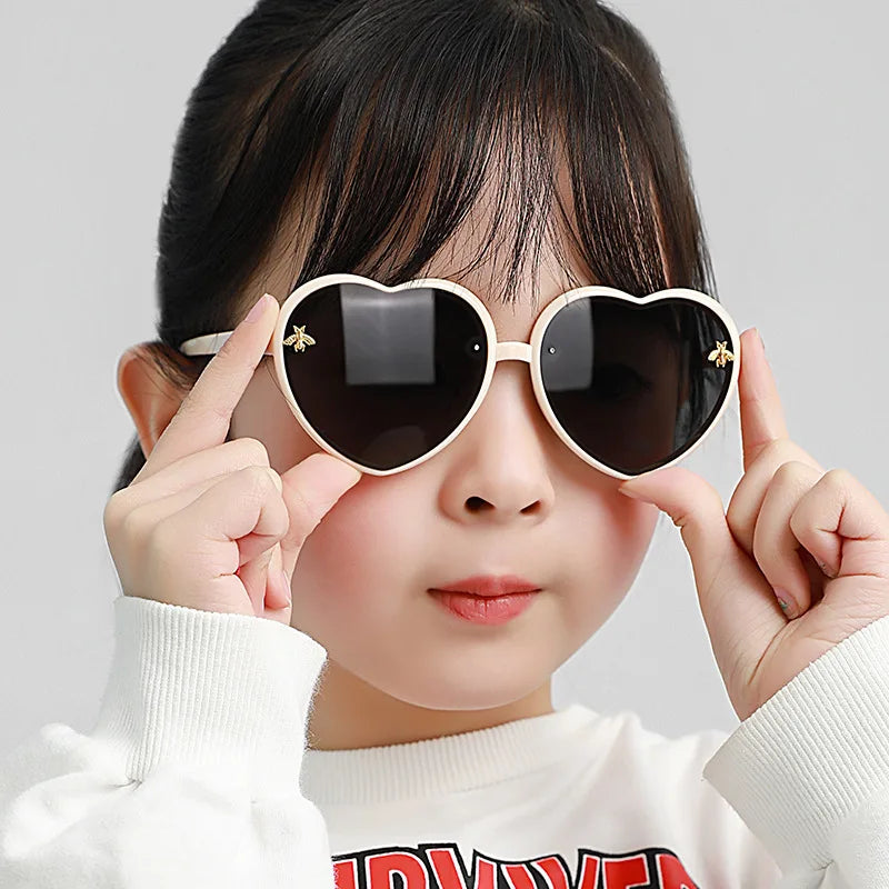 kids heart sunglasses, candy colour eyewear, UV400 kids glasses, cute cartoon sunglasses, trendy children’s eyewear, girls outdoor sunglasses, fashionable cat-eye frames, heart-shaped sun glasses, stylish kids eyewear, lightweight UV protection