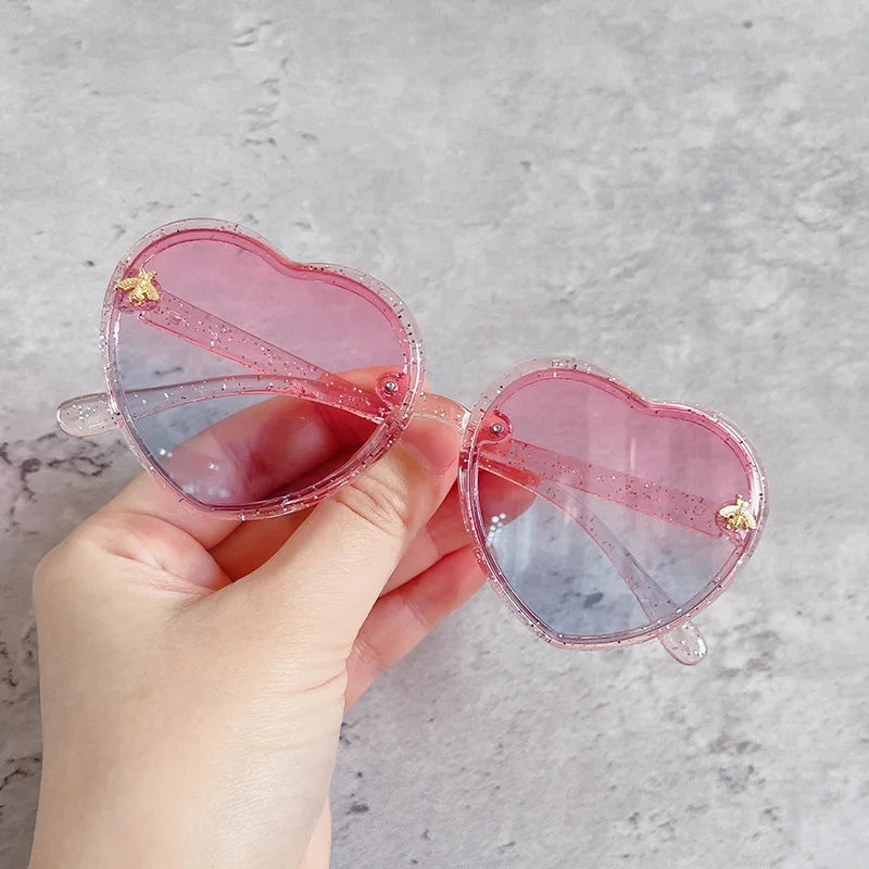 kids heart sunglasses, candy colour eyewear, UV400 kids glasses, cute cartoon sunglasses, trendy children’s eyewear, girls outdoor sunglasses, fashionable cat-eye frames, heart-shaped sun glasses, stylish kids eyewear, lightweight UV protection