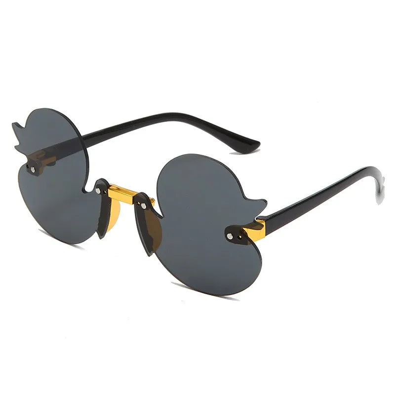 duck-shaped sunglasses, kids rimless eyewear, UV400 kids sunglasses, cartoon duck glasses, boys' fun sunglasses, anti-reflective sunglasses for kids, lightweight polycarbonate frames, kids decorative party glasses, playful sun protection, stylish children’s eyewear