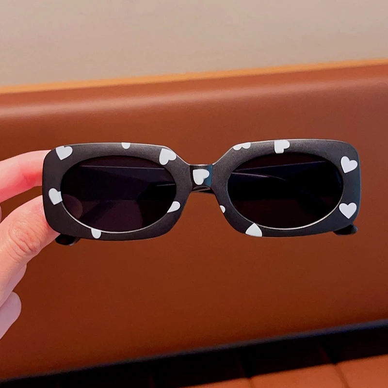 kids heart-shaped sunglasses, rectangular polarised eyewear, UV400 kids glasses, girls’ vintage sunglasses, trendy kids sun protection, outdoor kids eyewear, stylish wrap sunglasses, lightweight child sun shades, polycarbonate sunglasses for kids, glare-reducing eyewear