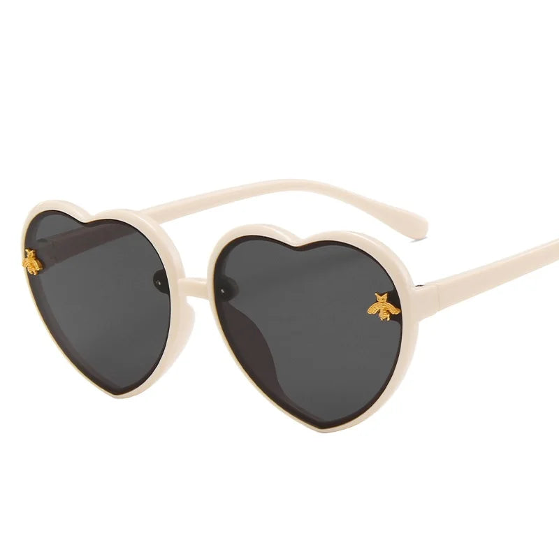 kids heart sunglasses, candy colour eyewear, UV400 kids glasses, cute cartoon sunglasses, trendy children’s eyewear, girls outdoor sunglasses, fashionable cat-eye frames, heart-shaped sun glasses, stylish kids eyewear, lightweight UV protection