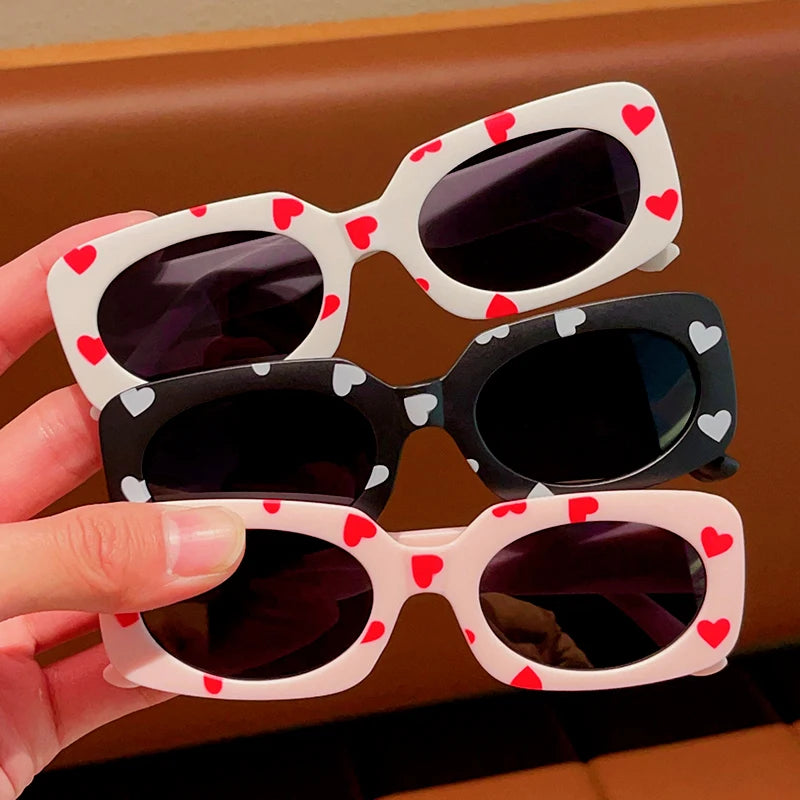 kids heart-shaped sunglasses, rectangular polarised eyewear, UV400 kids glasses, girls’ vintage sunglasses, trendy kids sun protection, outdoor kids eyewear, stylish wrap sunglasses, lightweight child sun shades, polycarbonate sunglasses for kids, glare-reducing eyewear