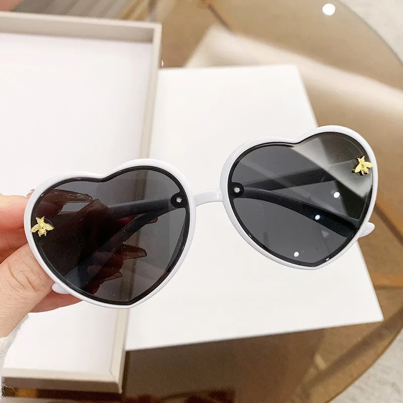 kids heart sunglasses, candy colour eyewear, UV400 kids glasses, cute cartoon sunglasses, trendy children’s eyewear, girls outdoor sunglasses, fashionable cat-eye frames, heart-shaped sun glasses, stylish kids eyewear, lightweight UV protection