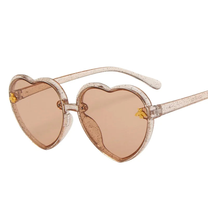 kids heart sunglasses, candy colour eyewear, UV400 kids glasses, cute cartoon sunglasses, trendy children’s eyewear, girls outdoor sunglasses, fashionable cat-eye frames, heart-shaped sun glasses, stylish kids eyewear, lightweight UV protection