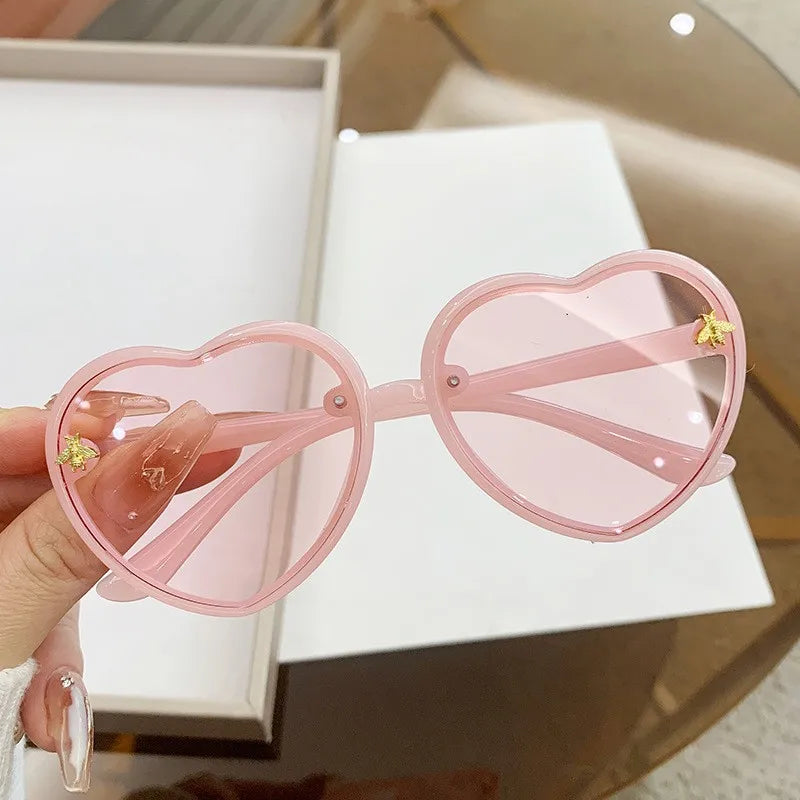 kids heart sunglasses, candy colour eyewear, UV400 kids glasses, cute cartoon sunglasses, trendy children’s eyewear, girls outdoor sunglasses, fashionable cat-eye frames, heart-shaped sun glasses, stylish kids eyewear, lightweight UV protection