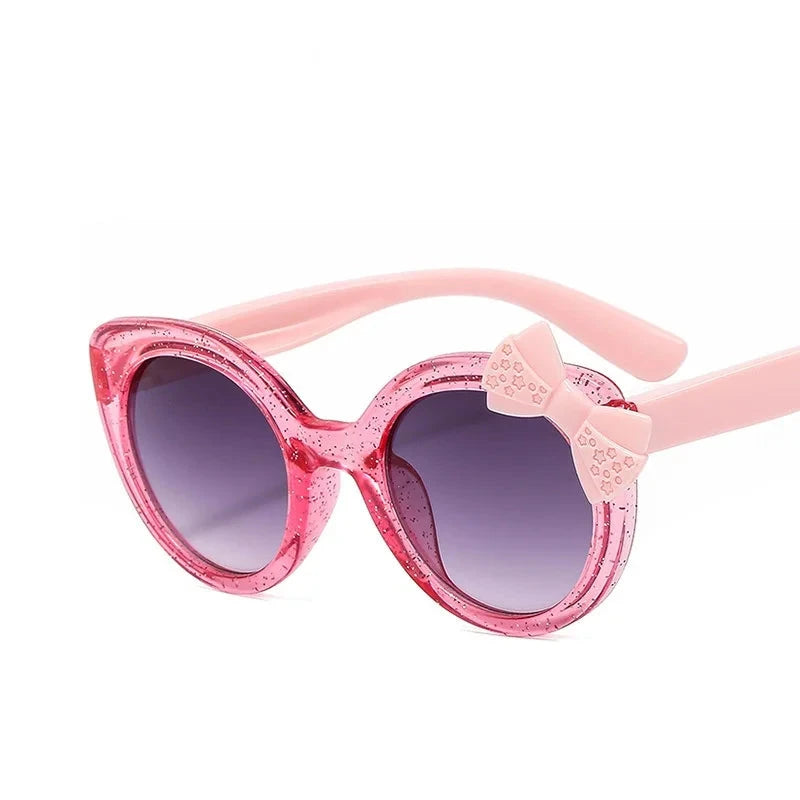 cat eye kids sunglasses, UV400 kids sunglasses, baby eyewear, 
bowknot sunglasses, girls' fashion sunglasses, cute children's eyewear, 
circular frame sunglasses, trendy baby shades, stylish girls' sunglasses, acrylic lenses, alla chic.