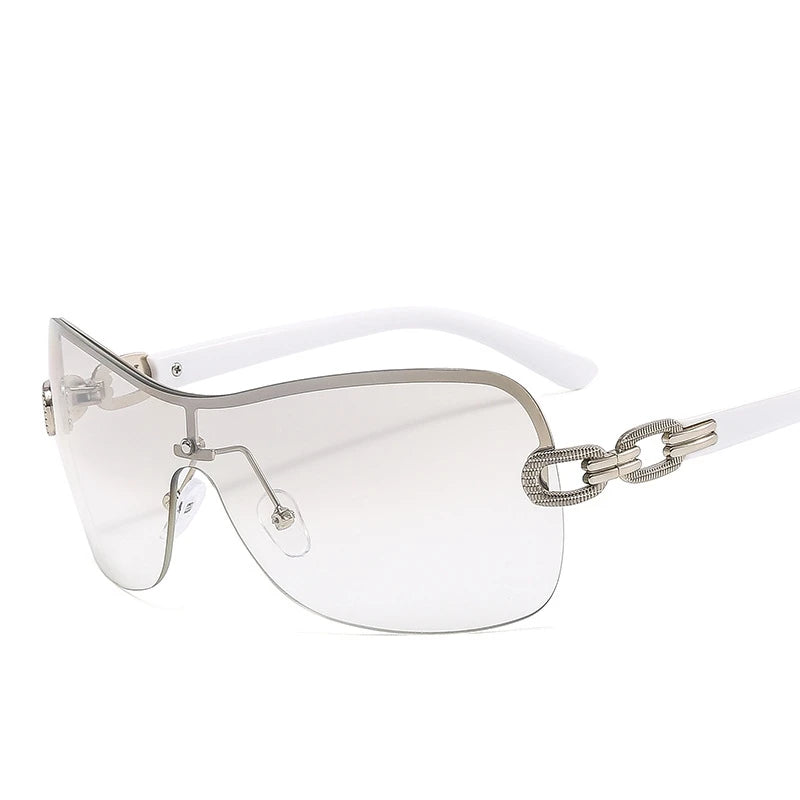 sunglasses, rimless sunglasses, heart-shaped sunglasses, 2000s fashion sunglasses, futuristic sunglasses, women's sunglasses, designer sunglasses, fashion sunglasses, unique sunglasses, lightweight sunglasses, comfortable sunglasses, UV protection sunglasses, stylish sunglasses, trendy sunglasses, 